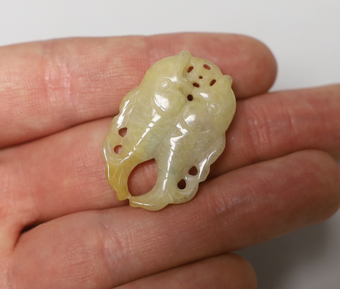 Three Chinese carved hardstone pendants